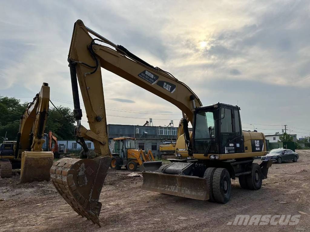 CAT M320D wheel excavator Pelle sur pneus