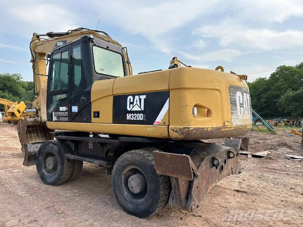 CAT M320D wheel excavator Pelle sur pneus