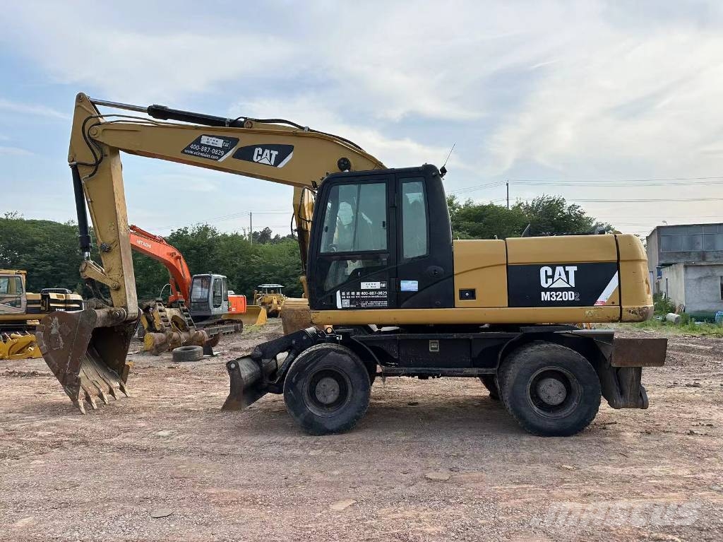 CAT M320D wheel excavator Pelle sur pneus