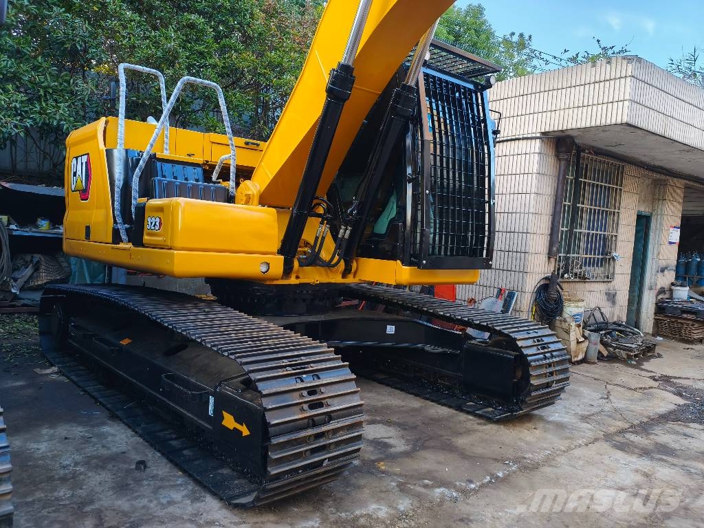 CAT 323 Гусеничні екскаватори