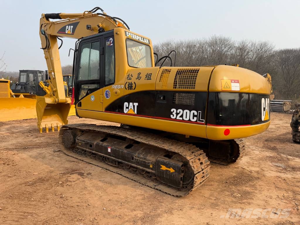 CAT 320 Гусеничні екскаватори