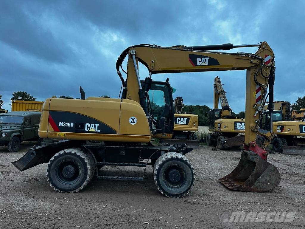 CAT M 315 D 30Km full Hydr. Top Zustand German machine حفارات بعجل