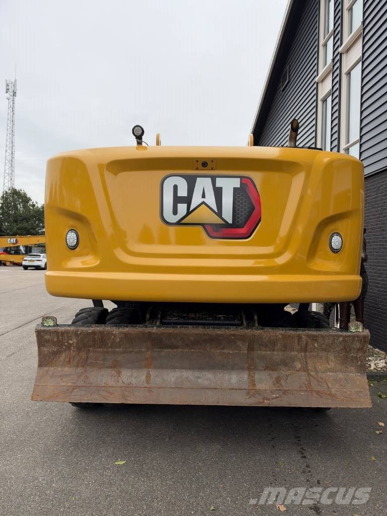 CAT M 322 F حفارات بعجل