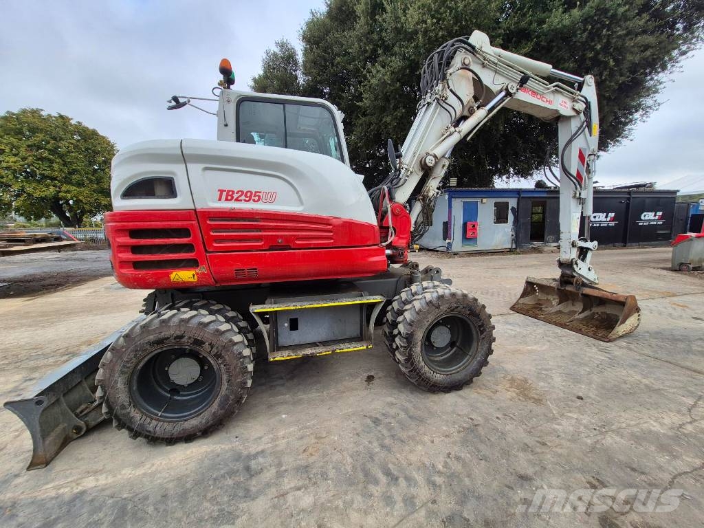 Takeuchi TB 295 W حفارات بعجل