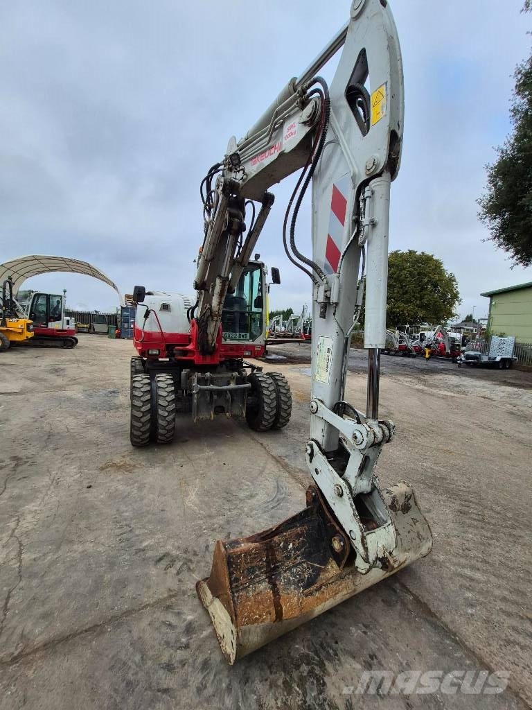 Takeuchi TB 295 W حفارات بعجل