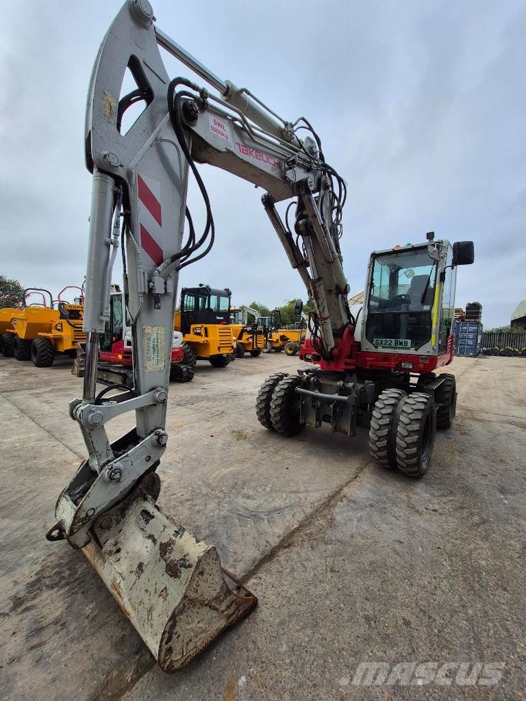 Takeuchi TB 295 W حفارات بعجل