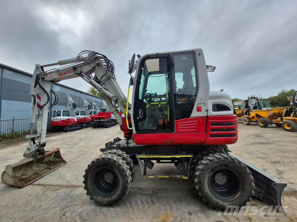 Takeuchi TB 295 W حفارات بعجل
