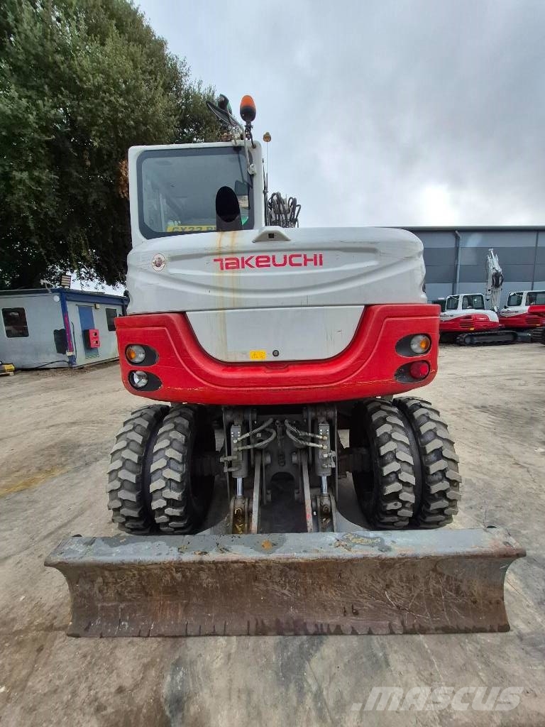 Takeuchi TB 295 W حفارات بعجل