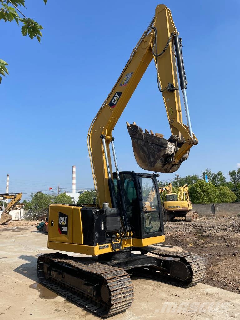 CAT 310 Rupsgraafmachines