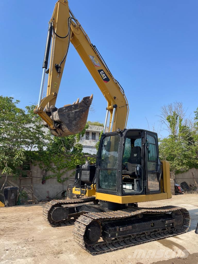CAT 310 Rupsgraafmachines