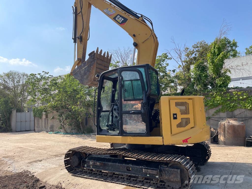 CAT 310 Rupsgraafmachines