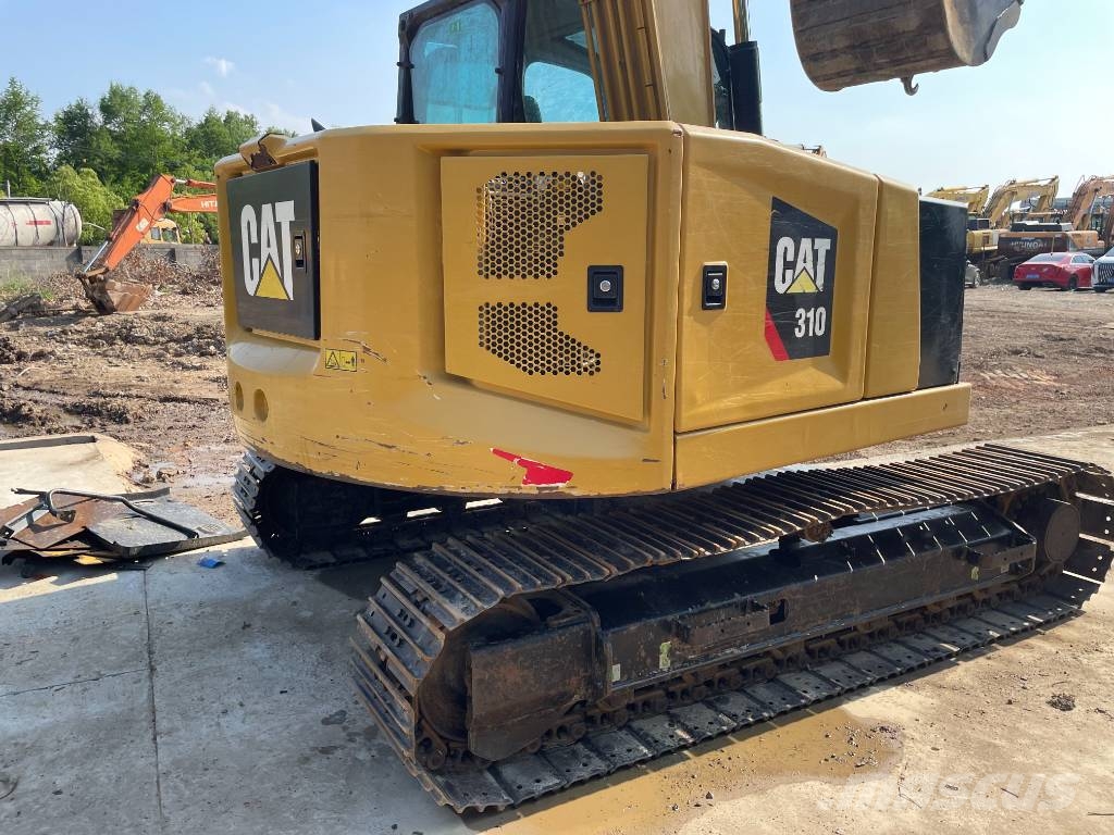 CAT 310 Rupsgraafmachines