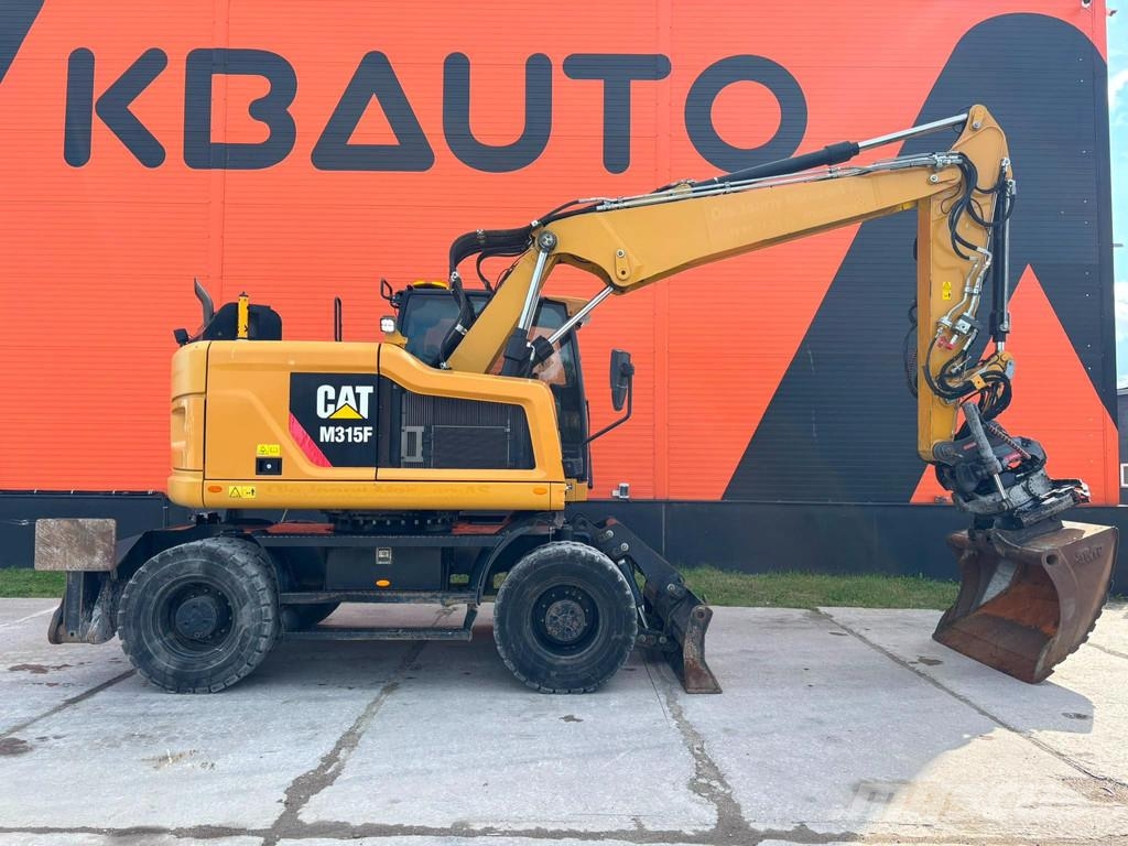 CAT M 315 F TILTROTATOR / AC / CENTRAL LUBRICATION Gumikerekes kotrók