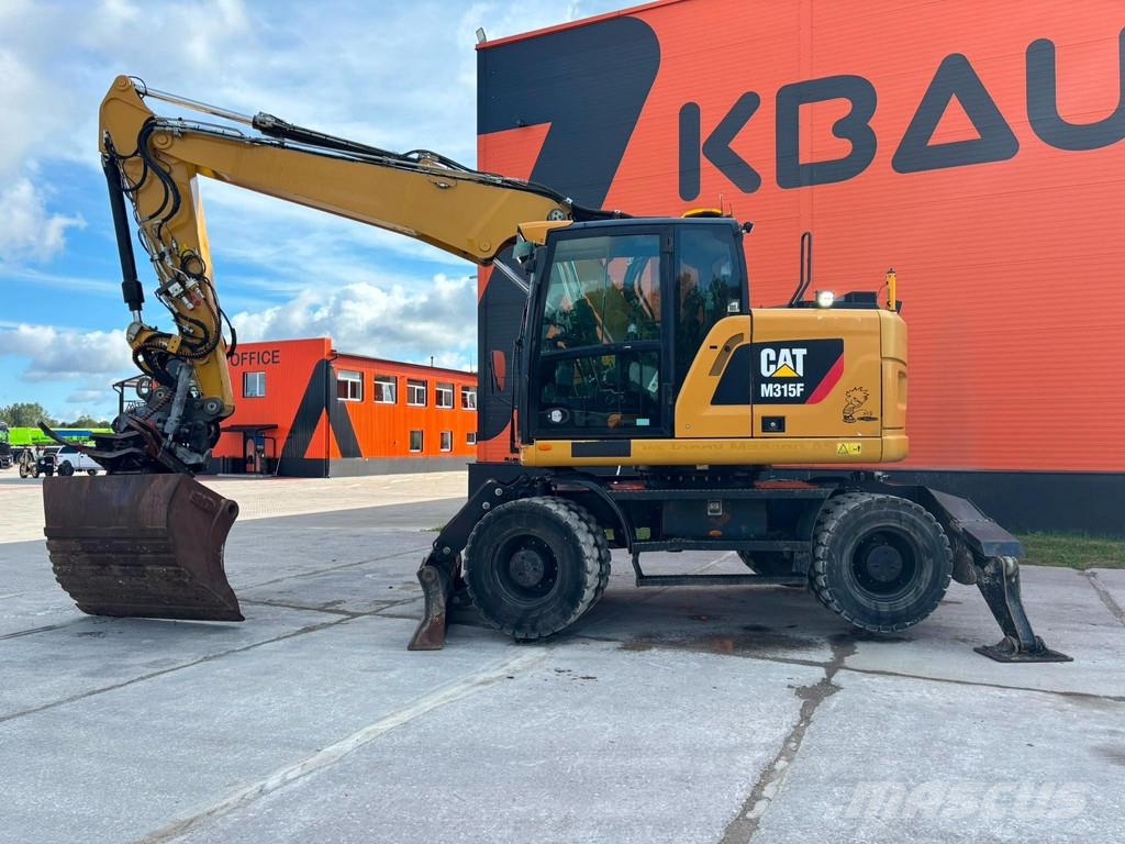 CAT M 315 F TILTROTATOR / AC / CENTRAL LUBRICATION Gumikerekes kotrók