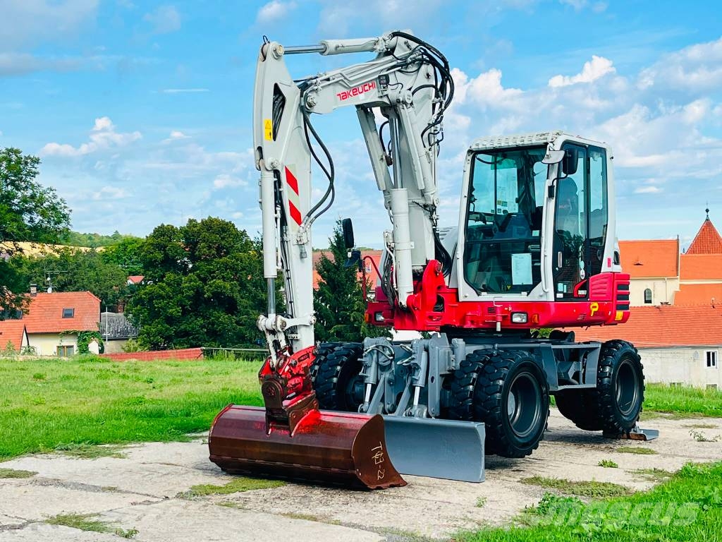 Takeuchi TB 295 W حفارات بعجل