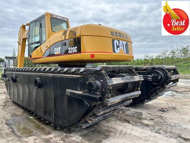 CAT 320 C Amfībijas tipa ekskavatori