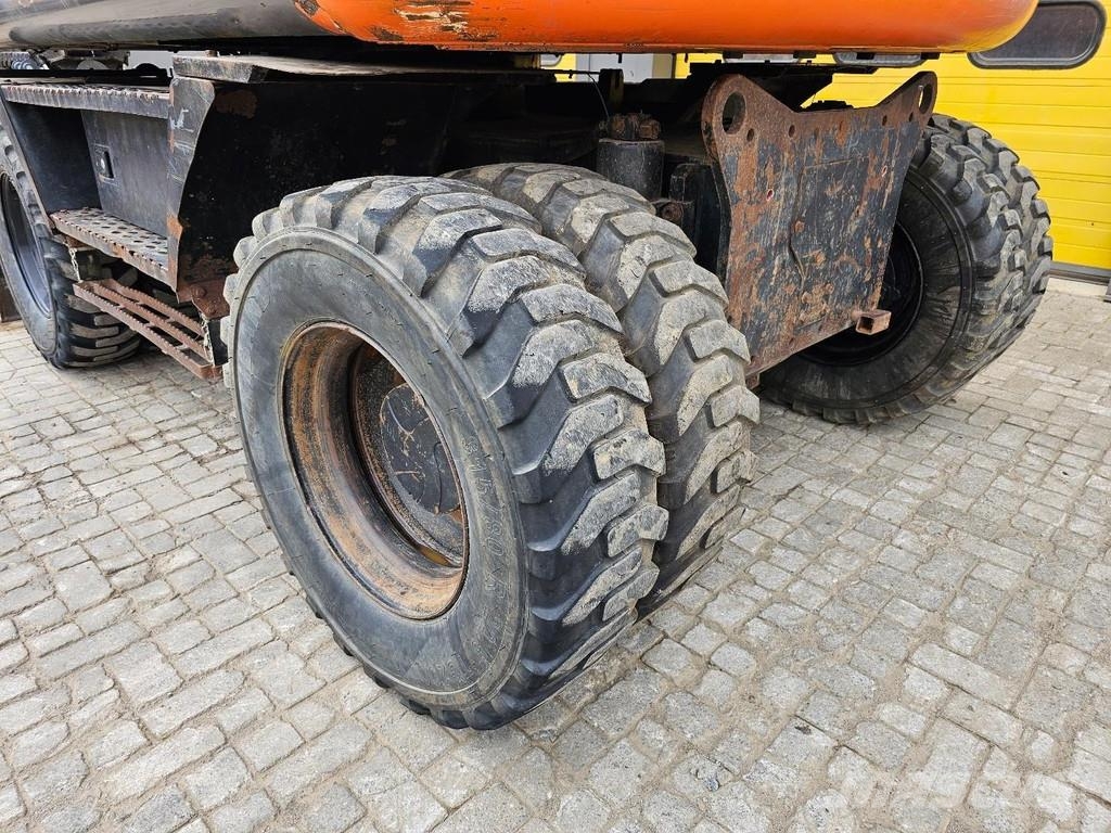 Hitachi ZX140W-3 حفارات بعجل