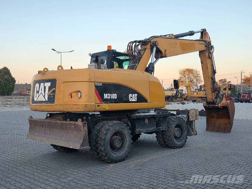 CAT M318D, 2014 ROK, PODPORY + PŁUG Ratasekskavaatorid