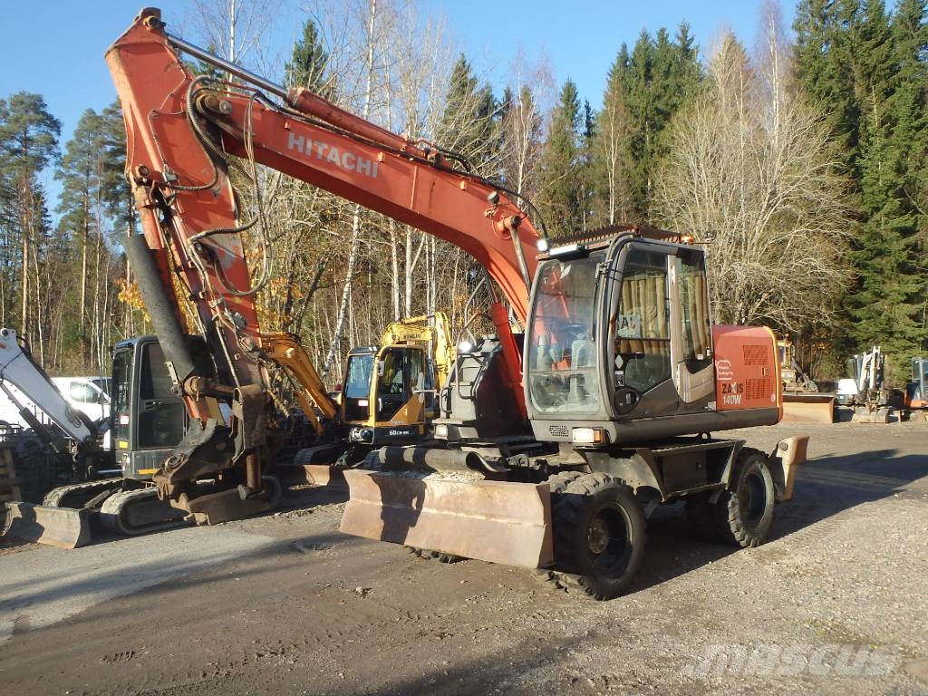 Hitachi ZX 140 W-3 kallistajalla 휠 굴삭기