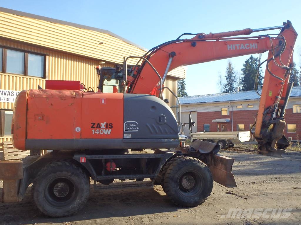 Hitachi ZX 140 W-3 kallistajalla 휠 굴삭기