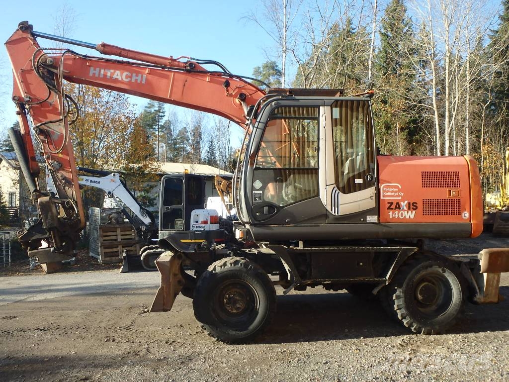 Hitachi ZX 140 W-3 kallistajalla 휠 굴삭기