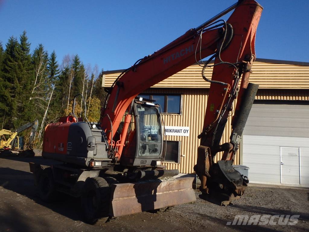 Hitachi ZX 140 W-3 kallistajalla 휠 굴삭기