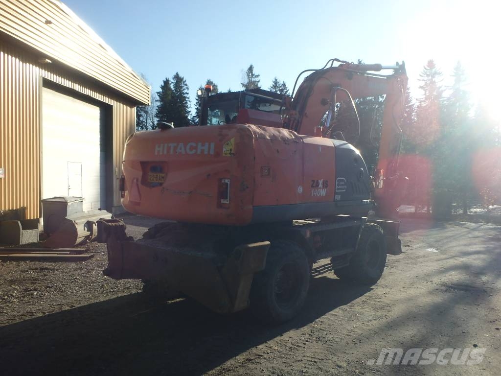 Hitachi ZX 140 W-3 kallistajalla 휠 굴삭기