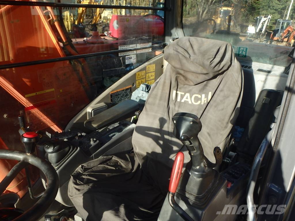 Hitachi ZX 140 W-3 kallistajalla 휠 굴삭기