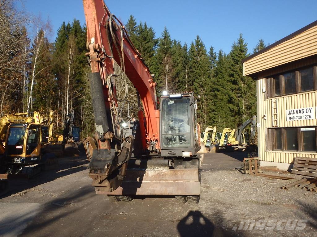Hitachi ZX 140 W-3 kallistajalla 휠 굴삭기