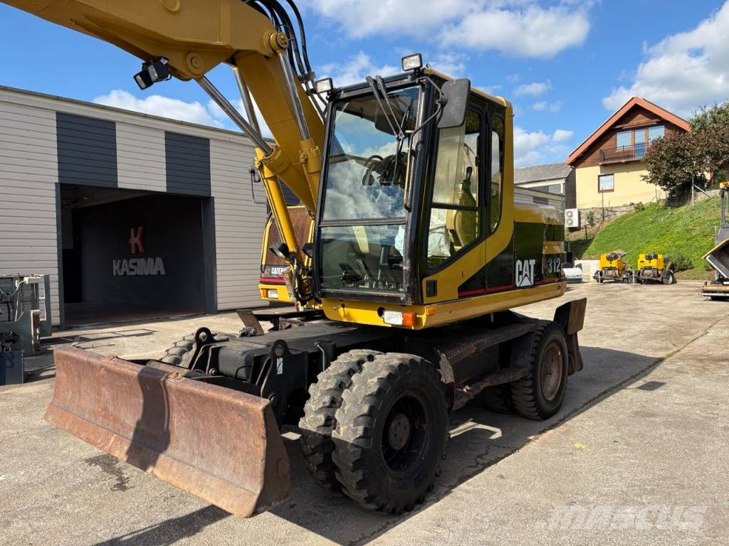 CAT M 312 Bagri na kolesih