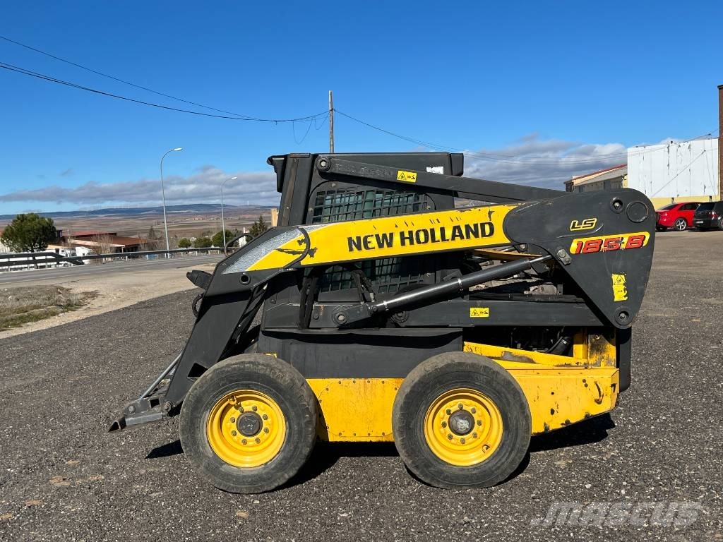 New Holland LS 185 B لوادر انزلاقية التوجيه