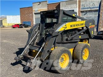 New Holland LS 185 B لوادر انزلاقية التوجيه