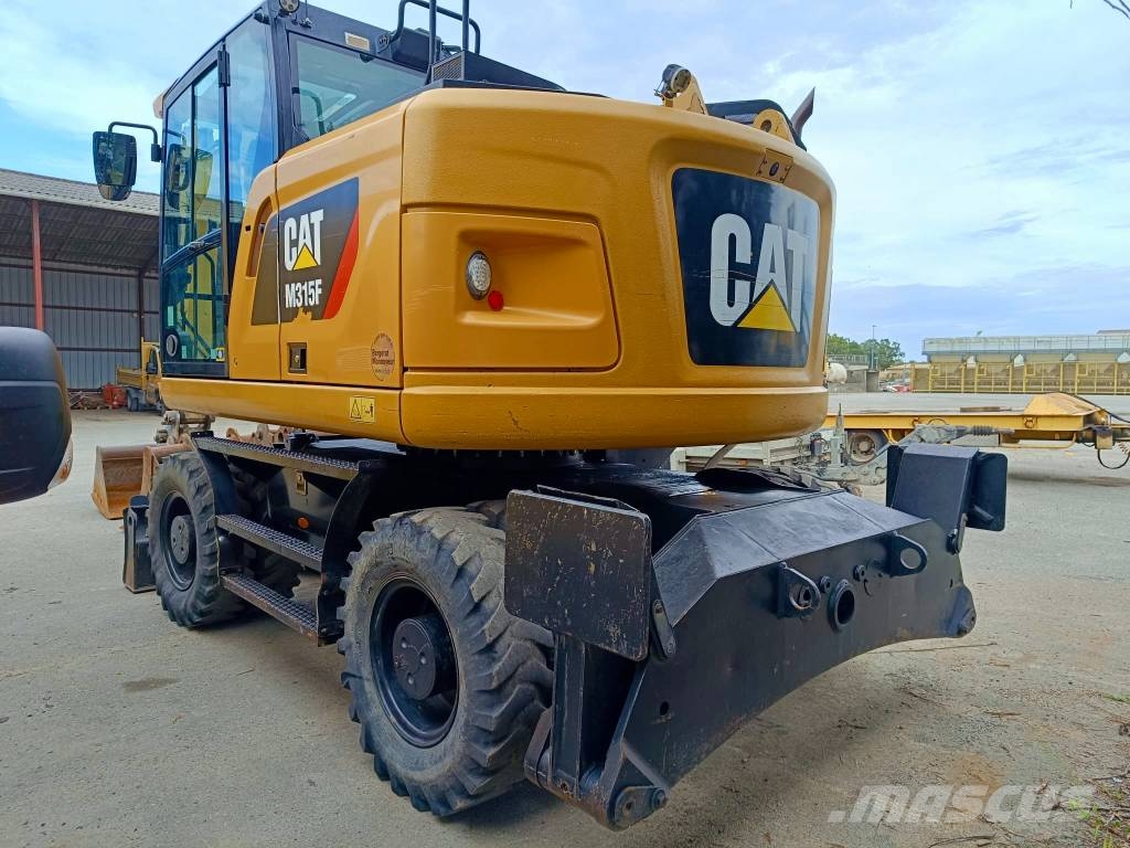 CAT 315 Pelle sur pneus