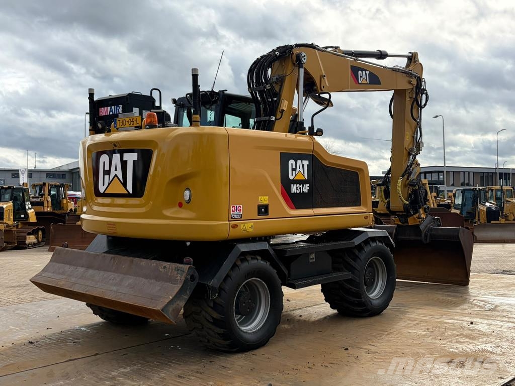 CAT M314F حفارات بعجل