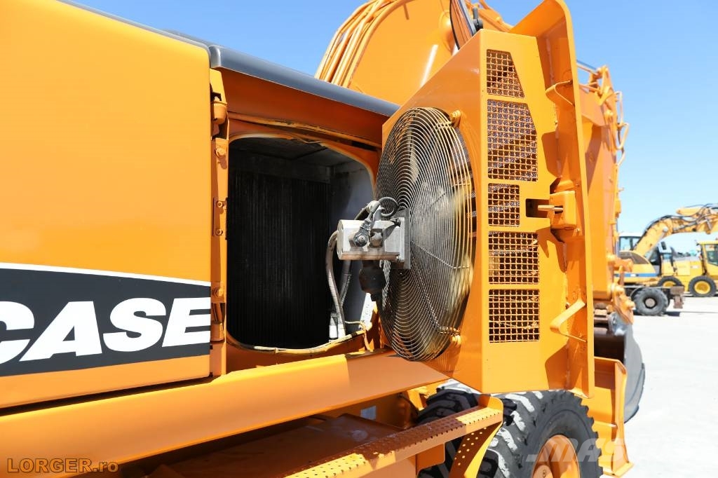 CASE WX 145 حفارات بعجل