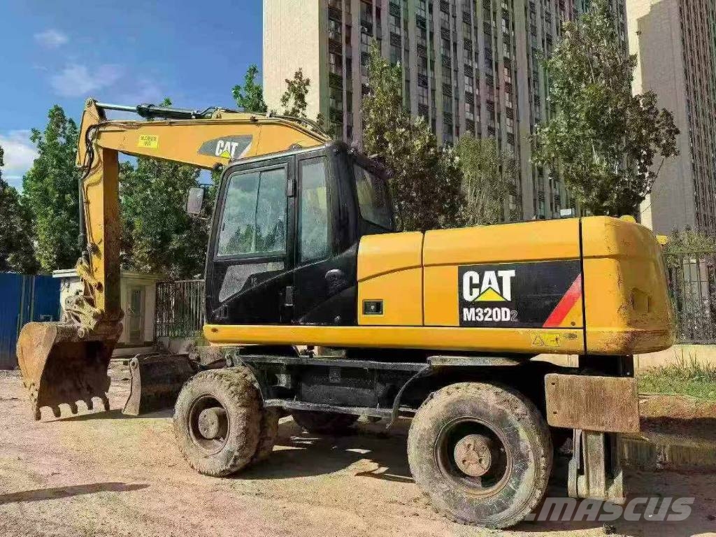 CAT M320D 휠 굴삭기