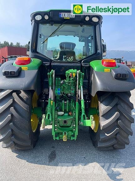 John Deere 6120M fjøring på framaksel og hytta Traktörler