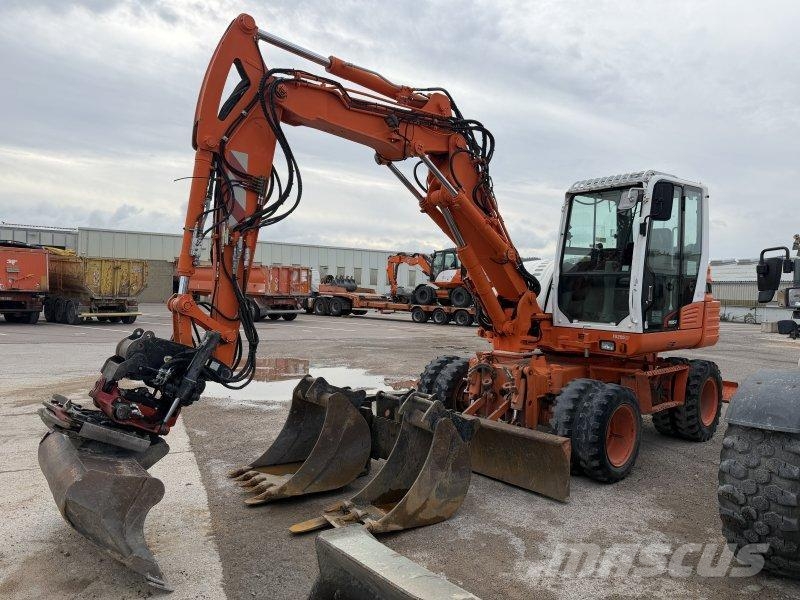 Takeuchi TB295W حفارات بعجل