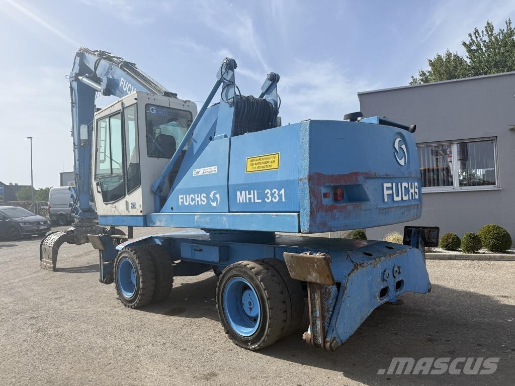 Fuchs MHL 331 Paleta de manipulare