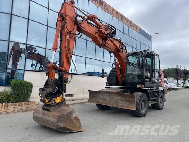 Hitachi ZX140W-5B حفارات بعجل