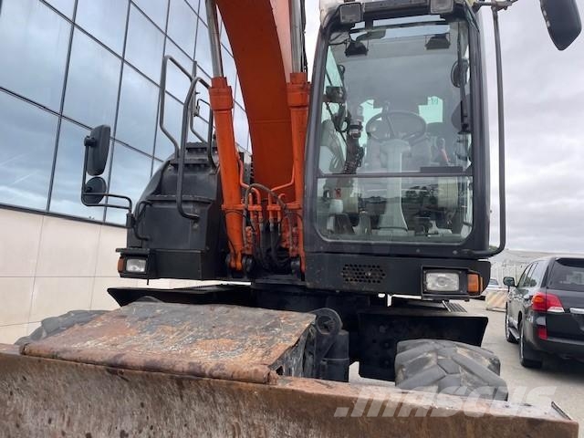 Hitachi ZX140W-5B حفارات بعجل