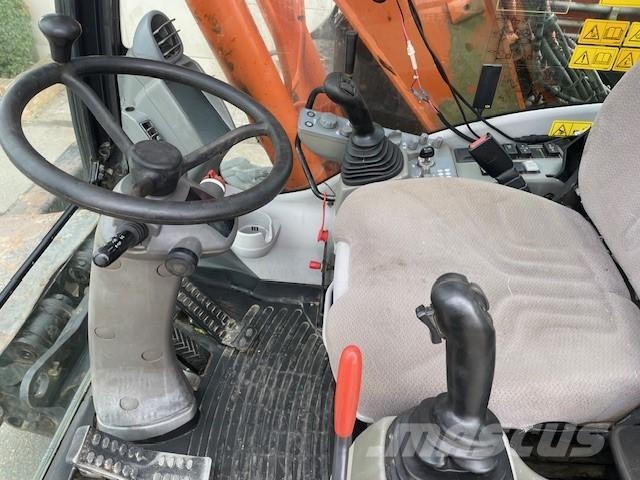 Hitachi ZX140W-5B حفارات بعجل