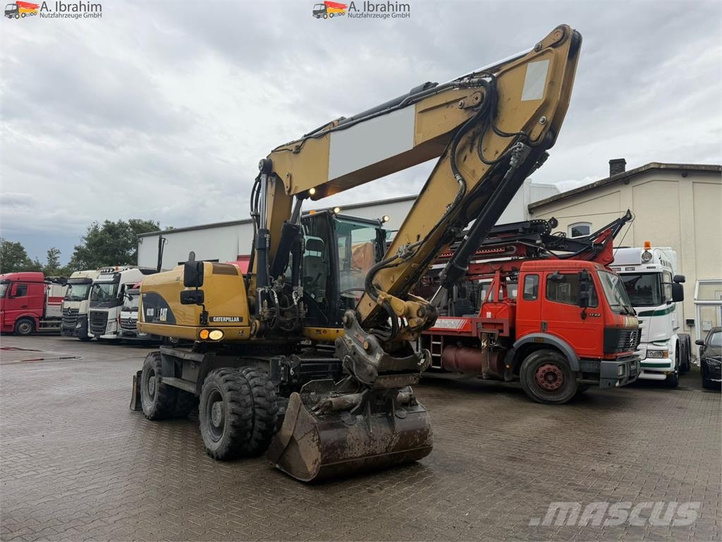 CAT M318D Schnellwechsler Schwenkfunktion OilQuick OQ7 Wheeled excavators