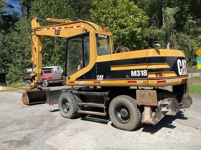CAT M318 Gravemaskiner på hjul