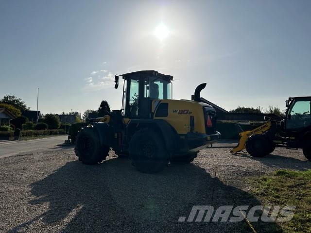 New Holland W 110D GUMMIHJULSLÆS لوادر بعجل