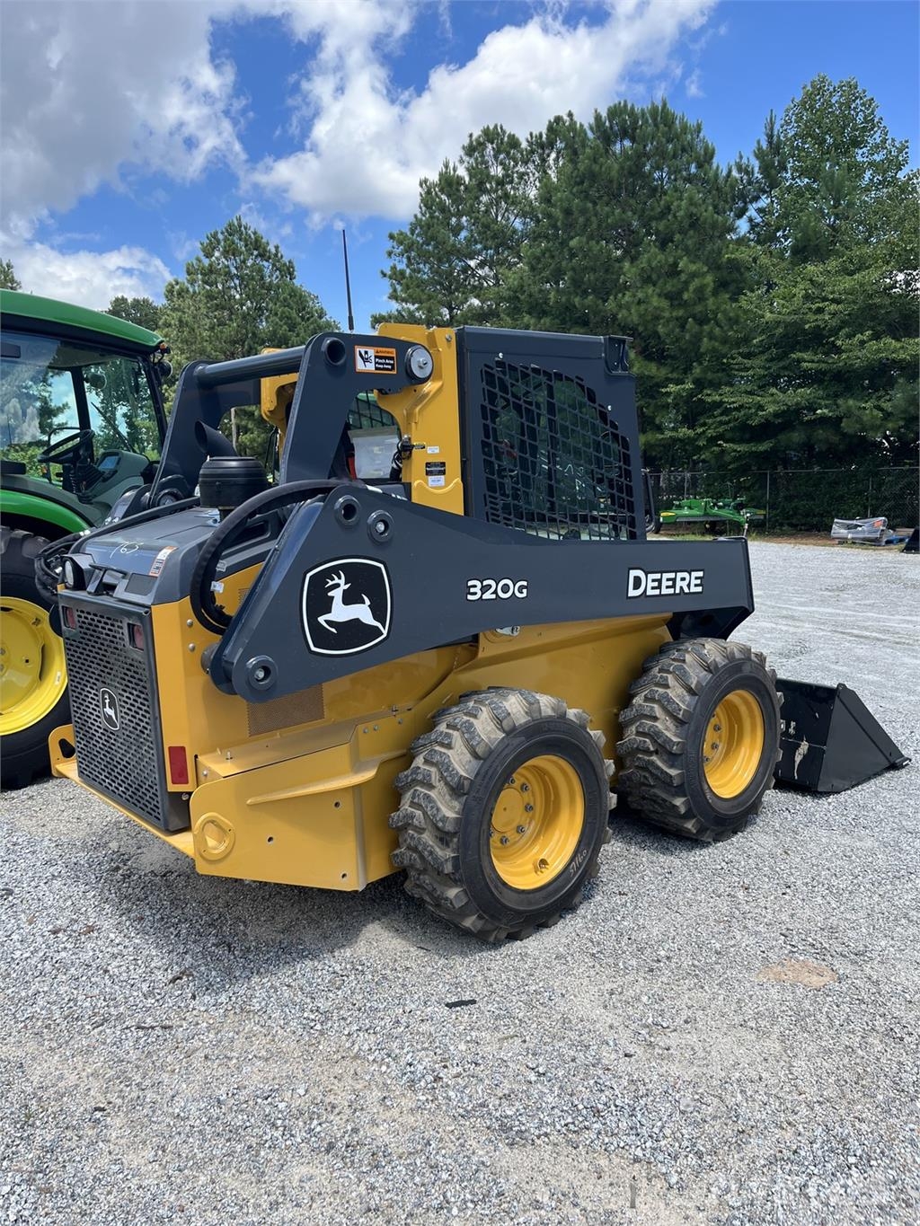 John Deere 320G Kompaktrakodók
