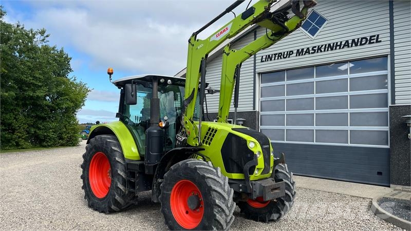 CLAAS Arion 610 Med frontlæsser Traktorok