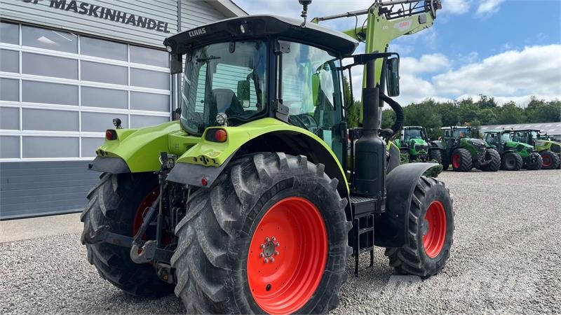 CLAAS Arion 610 Med frontlæsser Traktorok