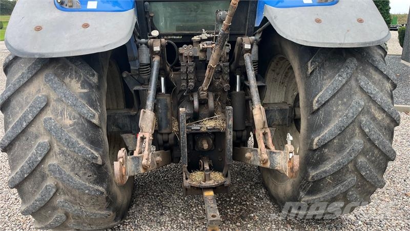 New Holland TM190 SS med frontlift Traktoren