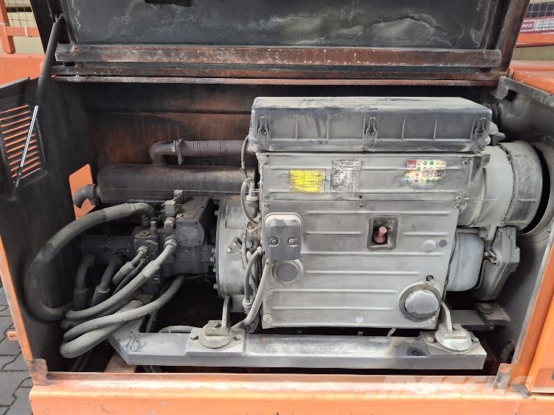 Holland Lift M-250DL27 4WD/P/N Elevadores de tesoura